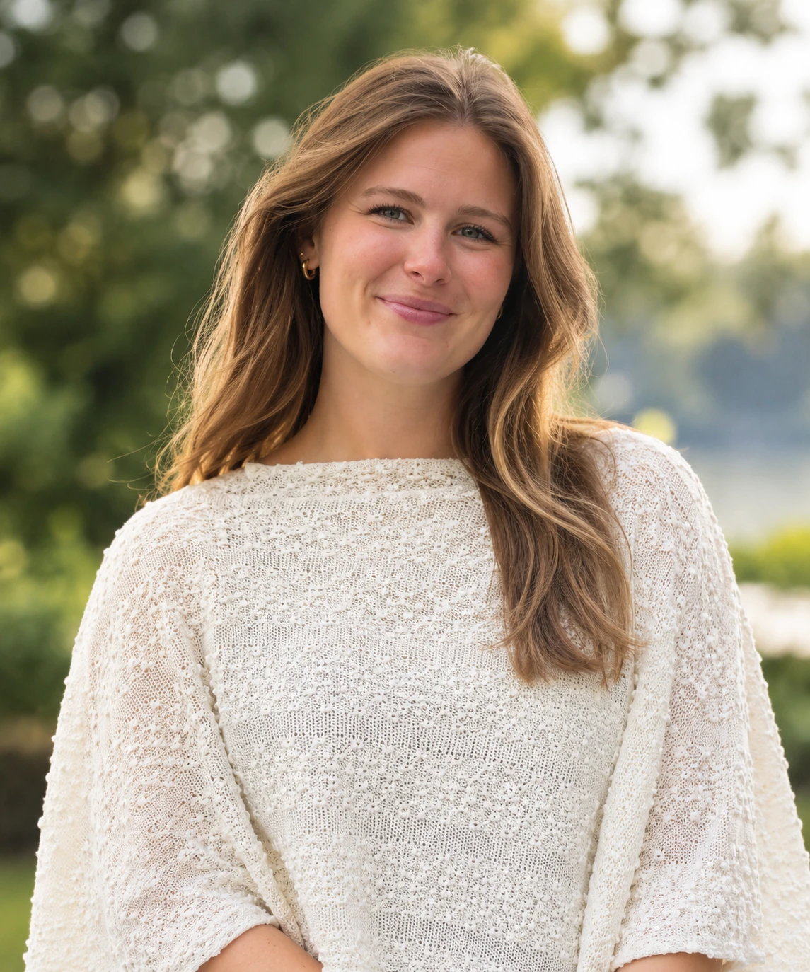 Maiah Horne outdoors in a cream sweater